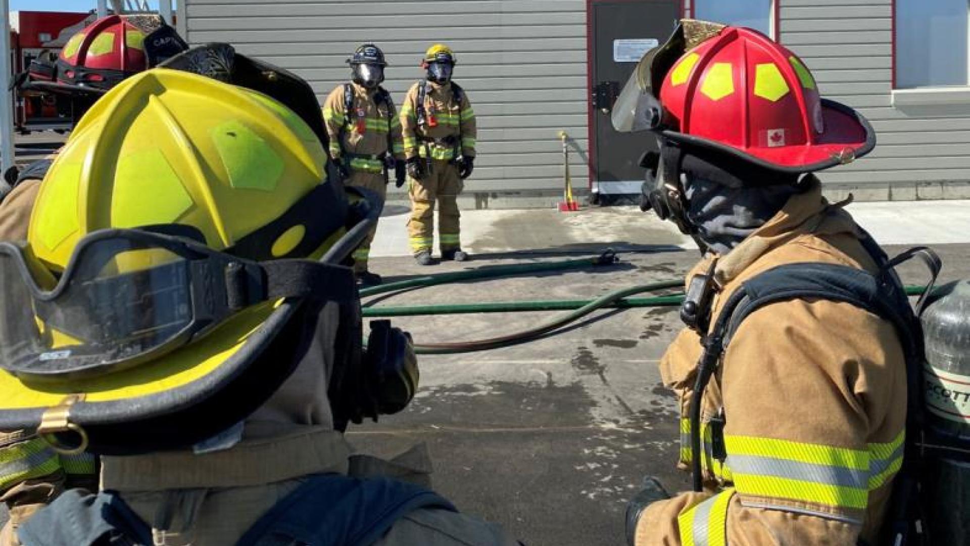 Firefighting crew discussing their next training scenario.