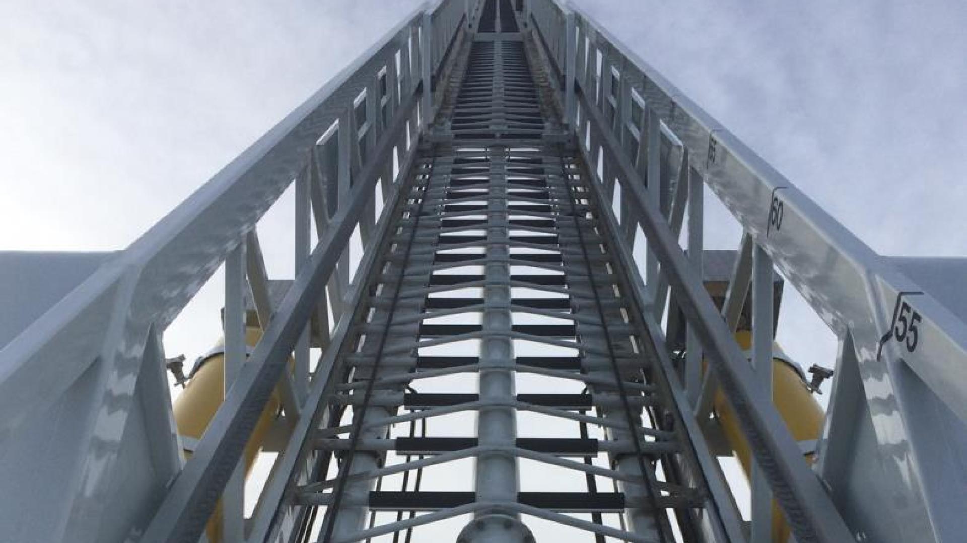 Firetruck ladder pointing upwards.