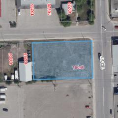 Aerial view of lot for sale. The lot is highlighted in a blue square.