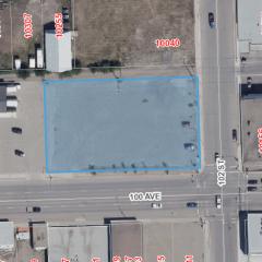Aerial view of lot for sale. The lot is highlighted in a blue square.