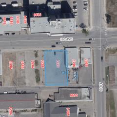 Aerial view of lot for sale. The lot is highlighted in a blue square.